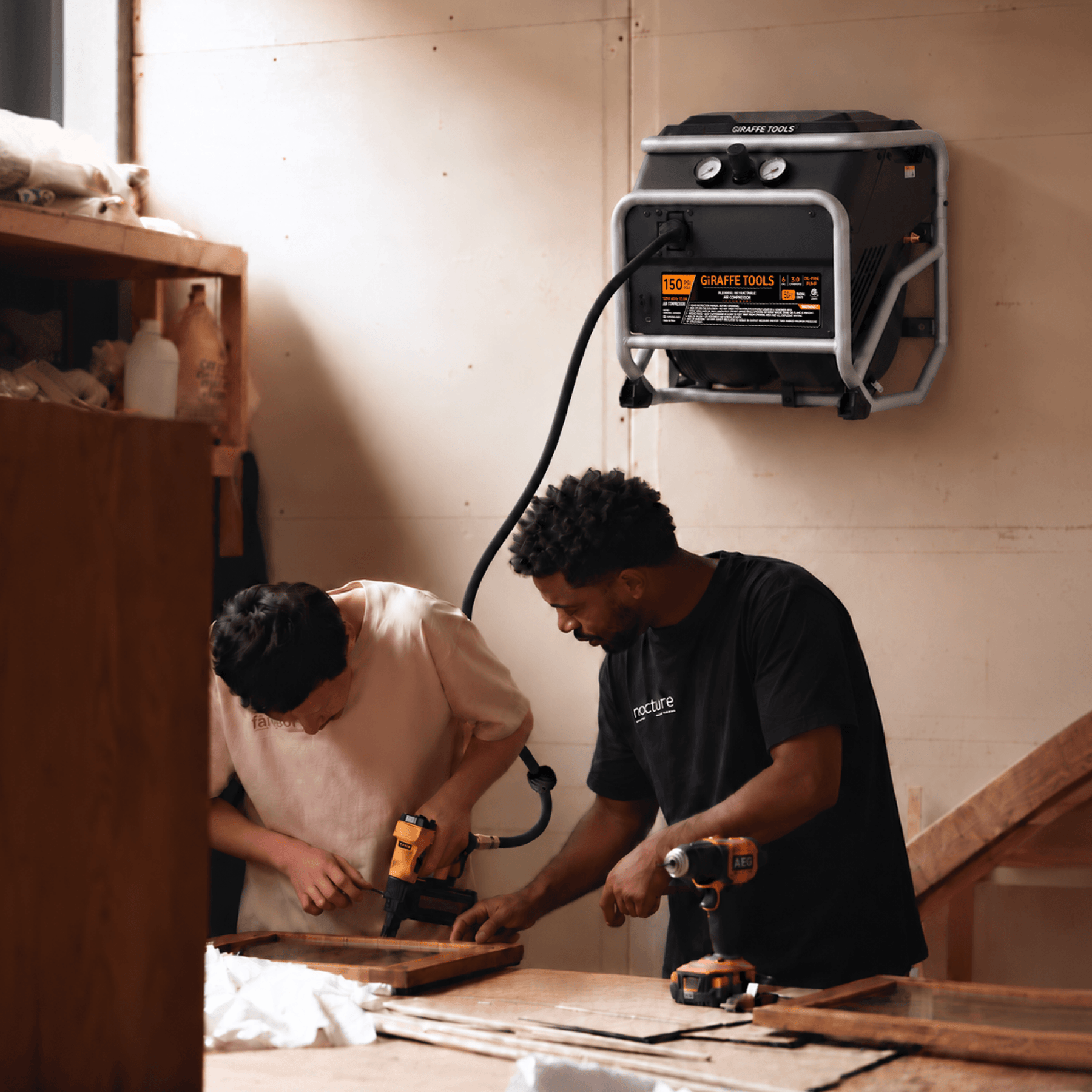 Wall-mounted FlexReel air compressor used for woodworking
