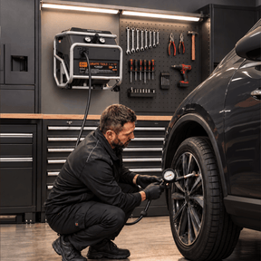 Giraffe Tools FlexReel air compressor inflating a car tire