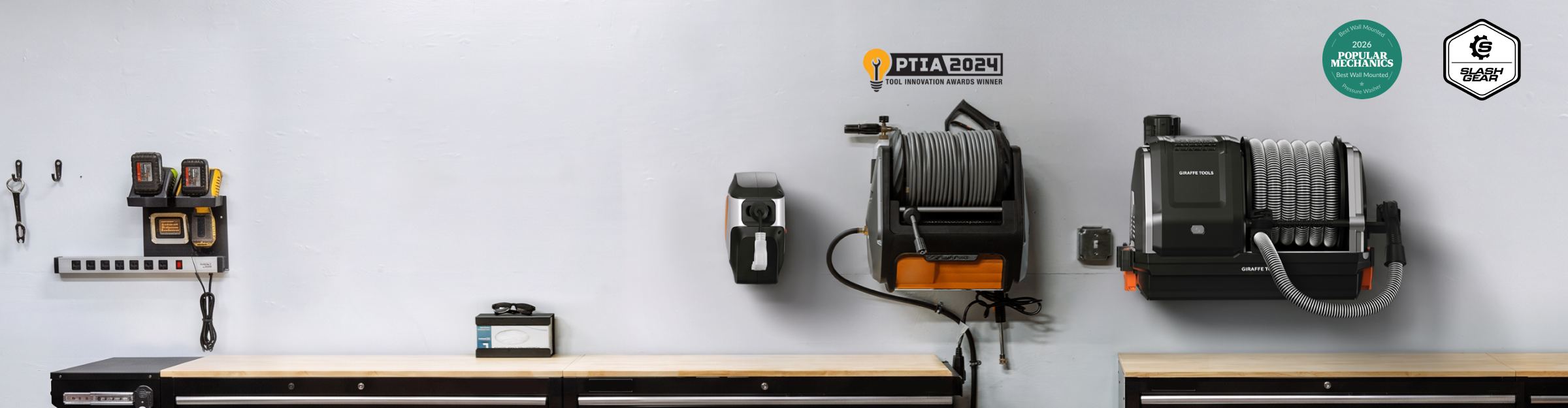 Giraffe Tools Dream Garage Bundle Banner: A workshop wall display featuring a wall-mounted espresso machine, coffee accessories, and two coffee grinders, with visible PFA+PRO and other certification logos on a white wall.