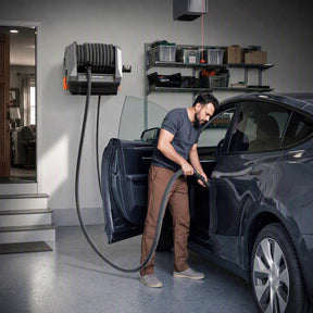 Giraffe Tools GrandFlux Retractable Vacuum Cleaner Plus Features showing car cleaning setup
